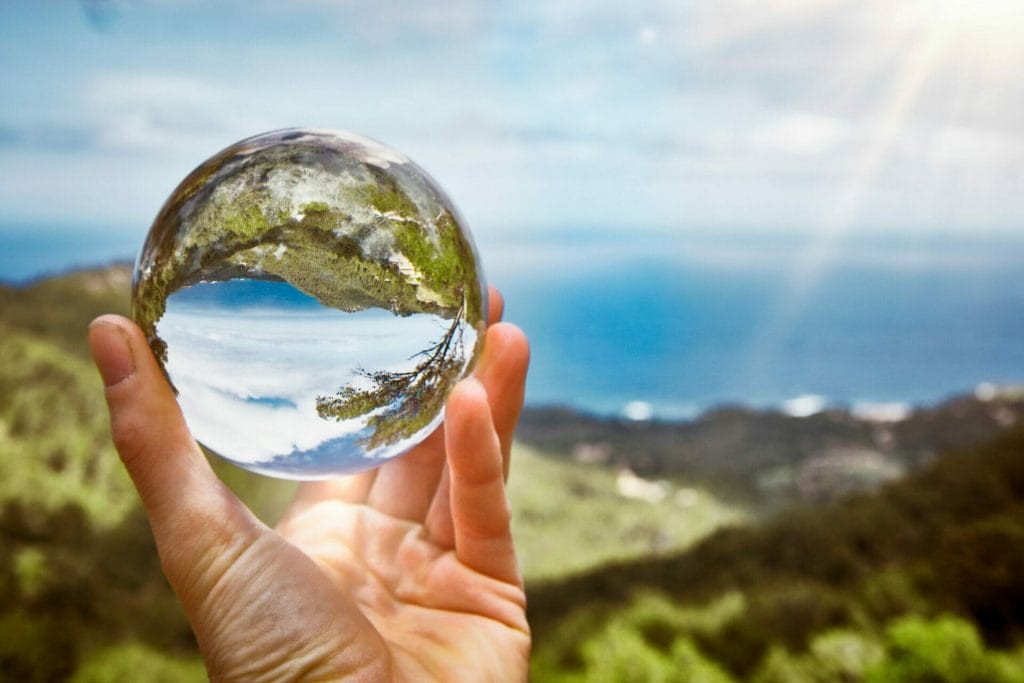 future hope glass ball overlooking the ocean