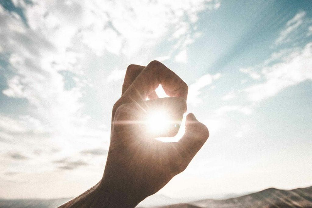 hand holding the sun aligning-your-firms-vision-and-strategy